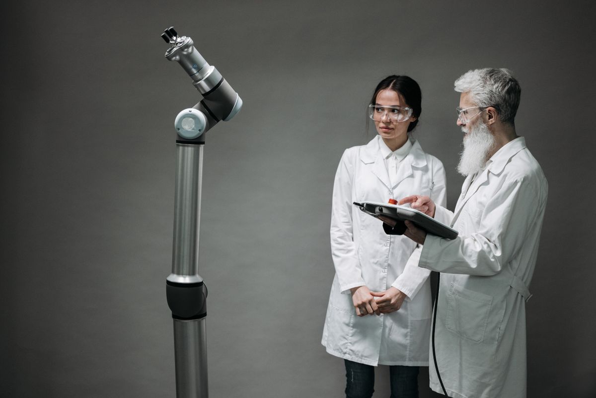 Source photo of researchers working with advanced technology in a laboratory